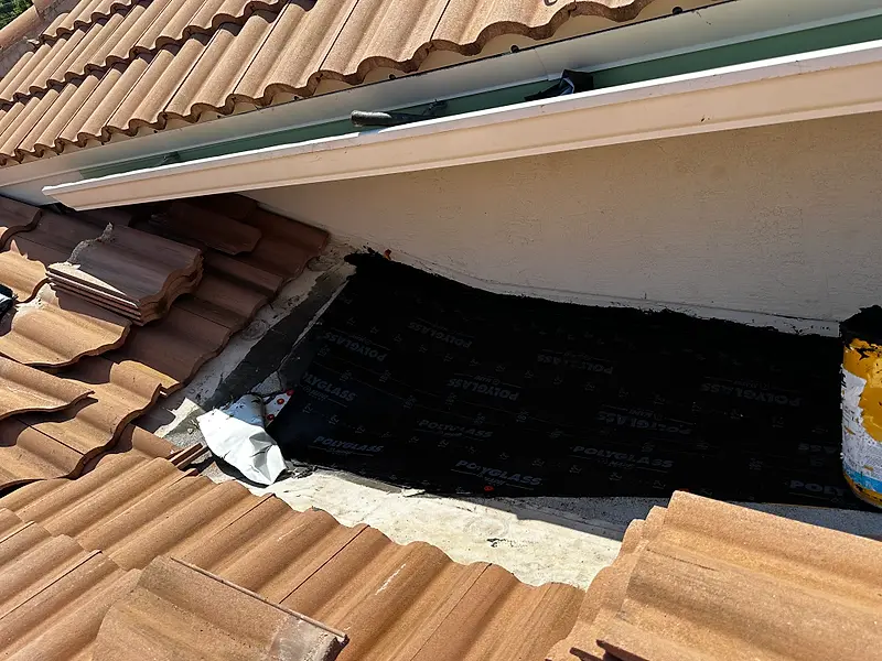 New underlayment beside a tile roof